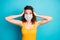 Photo of pretty scared student girl hands head staring wear mask yellow singlet  blue color background