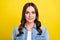 Photo of pretty shiny young woman dressed denim shirt smiling isolated yellow color background