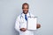 Photo of professional family doctor dark skin guy hold pen clipboard prescription insurance pharmacy showing place for