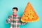 Photo of promoter guy hold big pizza pinata demonstrate hand wear plaid shirt bowtie isolated blue color background