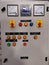 Photo of push buttons, elr, meters, selector switch and pilot lamps mounted on electrical door.