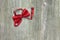 A photo of the red silk bow tie on the wooden table. Photo from above.