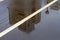 Photo of a reflection modern house in an autumn puddle.