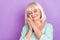 Photo of relaxed dreamy cute grandma hands cheek enjoy sleep close eyes wear blue shirt isolated violet color background