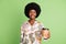 Photo of reliable barista girl give coffee cup genuine smile wear floral print shirt isolated on green color background