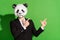 Photo of reliable manager guy indicate forefinger empty space wear panda mask black tux isolated on green color