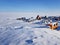 Photo of a residential town at a quarry for the extraction of sand. Snow-covered tundra, Russia, Gydansky peninsula