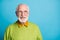 Photo of retired grandfather look side empty space wear spectacles green sweater isolated blue color background