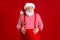 Photo of retired grandpa grey beard hands hold large paunch stomach after attending fast food cafe wear santa costume