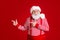 Photo of retired old man white beard direct finger empty space suggest interesting solution wear santa x-mas costume