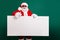 Photo of retired stylish grandfather grey hair beard hold white board thumb-up assure chosen object wear red santa x-mas
