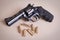 Photo of a revolver handgun pistol with bullets