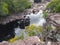 Photo of rocks with a well inthe trail for the Buracao Waterfall, in Chapada Diamantina, state of Bahia-Brasil/Brazil.