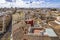 Photo of the roofs of old buildings with roof terraces and the old town with its many church towers, taken from the Porta de Sarra