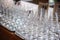 Photo of rows of empty glasses for champagne on the table