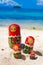 Photo Rows Puzzle Russian Dolls Matrioshka Family Souvenir Untouched Tropical Beach in Bali Island. Vertical Picture