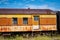 Photo of a rusted old passenger train abandoned weathering