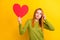 Photo of sad orange hair millennial lady look heart wear green sweater isolated on yellow color background