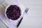 Photo salad of chopped purple cabbage in a plate on a napkin on