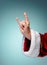 Photo of Santa Claus hand in rocker gesture