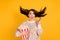 Photo of scared crazy young woman fly hair wind hold pop corn bucket horror movie  on yellow color background