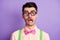 Photo of scared nerd man wear glasses green suspenders pink bow tie isolated on violet color background