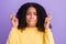 Photo of scared nervous dark skin woman wear yellow sweater fingers crossed biting lips closed eyes isolated violet