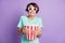 Photo of scared young woman dressed casual turquoise clothes 3d cinema eyeglasses holding popcorn bucket isolated violet