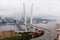 Photo of sea bay with buildings, ships, bridge