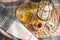 Photo with selected of focus breakfast in the bed on checkered plaid and round wicker tray with dried apricots, coconut and cup of