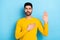 Photo of serious confident man wear yellow sweater promising tell truth isolated blue color background