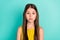 Photo of serious nice brown hair girl wear yellow dress isolated on bright teal color background