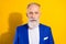 Photo of serious old businessman grandfather wear blue blazer beard isolated on shine yellow color background