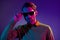 Photo of serious positive cool young man wear sunglass night club life isolated on gradient neon background