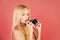 Photo services. Sensual woman with long blonde hair on pink.