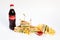 Photo session new menu of coffee house, fresh club sandwich, glass bottle of Coca Cola, french fries, ketchup isolated on white