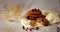 Photo with several cookies on a gray ceramic plate with cranberries and dried flowers in the background