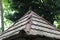 photo of several pigeons perched on the roof