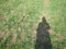 Photo of shadow of girl on grassy meadow