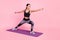 Photo of shiny charming young lady sportswear doing exercises hands arms sides isolated pink color background