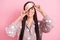 Photo of shiny laughing young woman sleepwear hands arms mask cover eye isolated pink color background