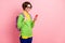 Photo of shiny woman wear green cardigan spectacles rucksack looking modern gadget empty space isolated pink color