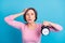 Photo of shocked amazed surprised mature woman hold clock missed alarm having problem isolated on blue color background