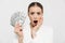 Photo of shocked businesswoman 20s wearing elegant jacket holding fan with dollar money banknotes