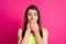 Photo of shocked pretty young woman close mouth do mistake dress green top isolated on vibrant pink background