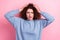 Photo of shocked speechless woman dressed blue sweatshirt arms disgusting hairstyle isolated pink color background