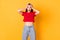 Photo of shocked terrified lady hands on head open mouth wear red crop top jeans isolated on bright yellow color