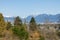 The photo showcases a beautiful viewpoint inside Queen Elizabeth Park in Vancouver, with majestic mountains in the background