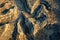 This photo showcases an expansive desert mountain range as seen from an elevated perspective, Topography of a national park from