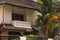 photo showcases a stone balcony overlooking courtyard and palm tree